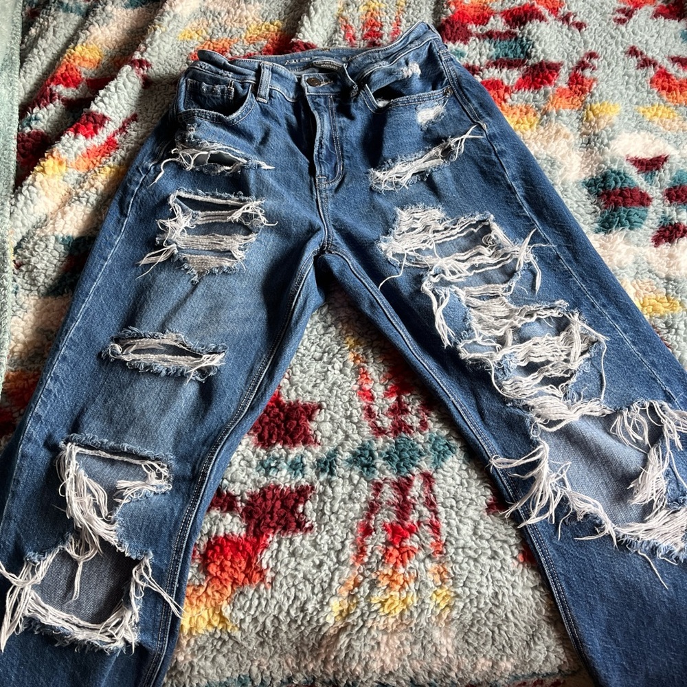Blue low-rise ripped jeans 
(Brand: American Eagle)